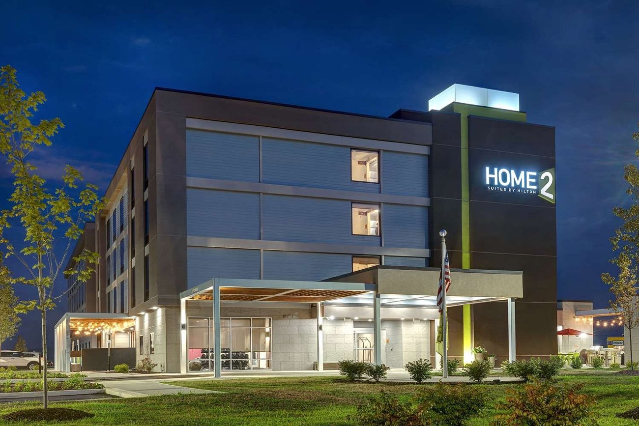 Completed Home2 Suites by Hilton at dusk, built by SunMar Group